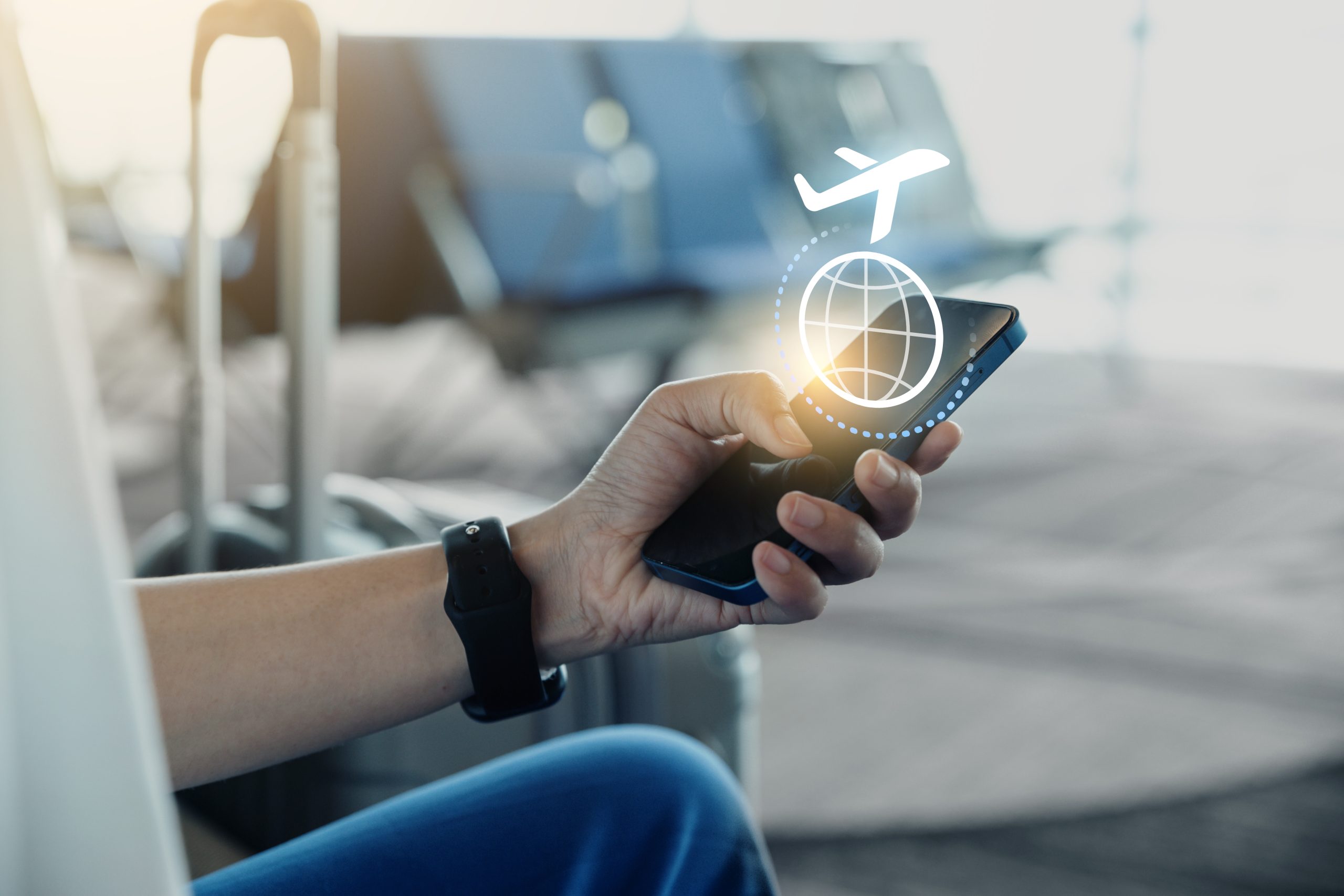 Young man using phone with check travel time or in-flight insura