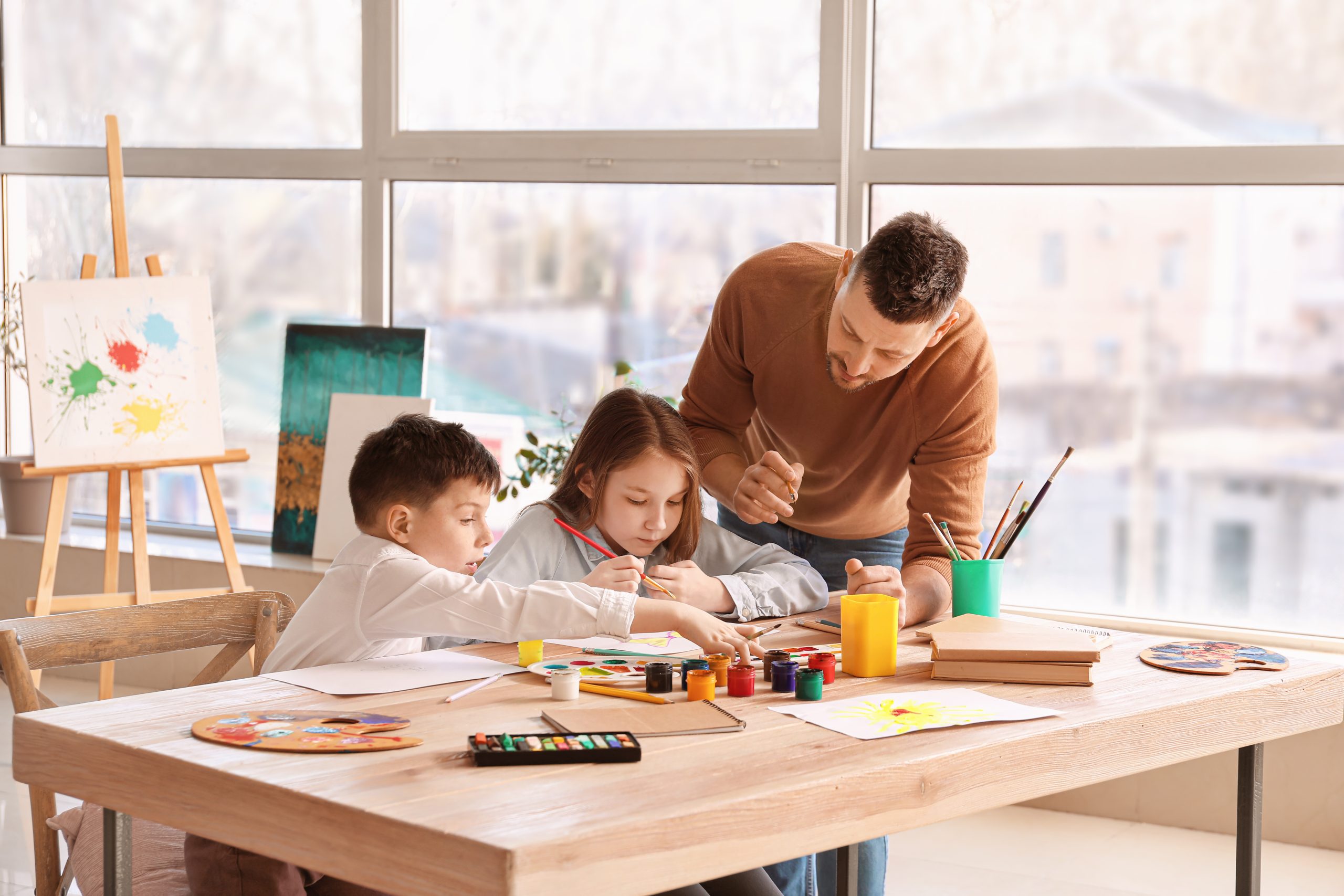 Drawing teacher giving optional classes at school